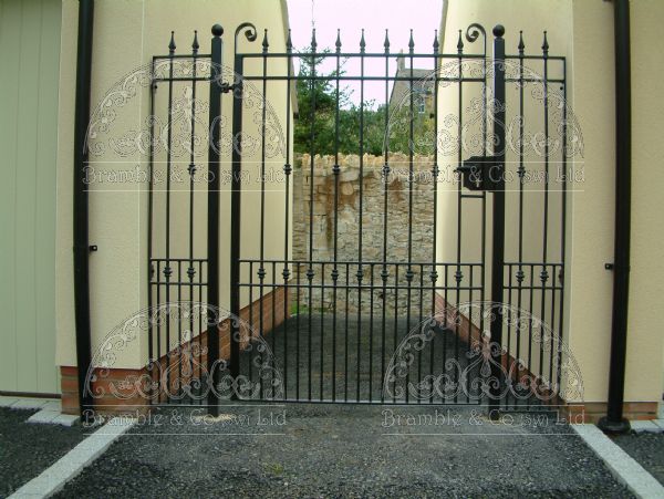 Gate with side panels between garages. Devon